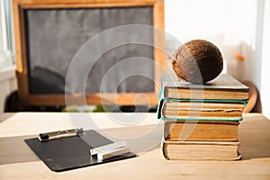 Stack of old books on wood desk