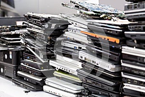 Stack of old, broken and obsolete laptop computer for repair