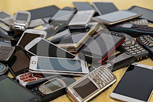 Stack of old cell phones for recycling photo