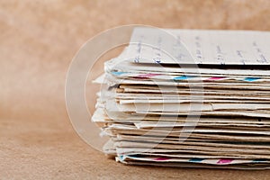 Stack of old envelopes and letters on kraft paper