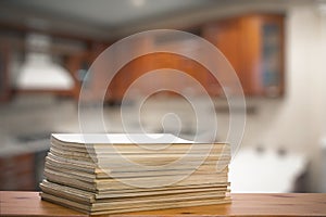 Stack of old magazines on wooden table