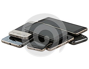 Stack of old mobile phones on white background - generated by ai