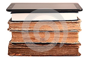 Stack of old and new books, digital tablet isolated on white. New technologies. Choice between paper books and e-reader