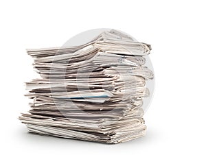 A stack of old newspapers isolated on white