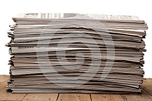 A stack of old newspapers on white background
