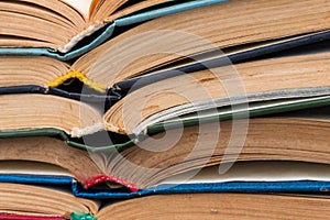 Stack of old open books for background