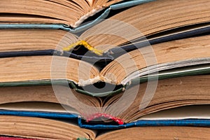 Stack of old open books for background