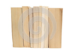 Stack of old paperback books on white background