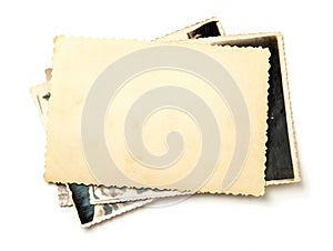 Stack old photos isolated on white background. Mock-up blank paper. Postcard rumpled photo