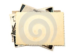 Stack old photos isolated on white background. Mock-up blank paper