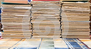 A stack of old school notebooks. Multicolored cover