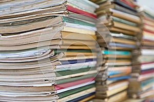 A stack of old school notebooks. Multicolored cover