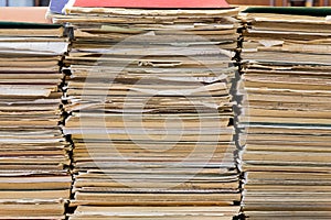 A stack of old school notebooks. Multicolored cover