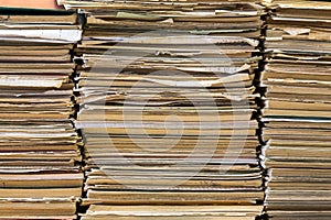 A stack of old school notebooks. Multicolored cover