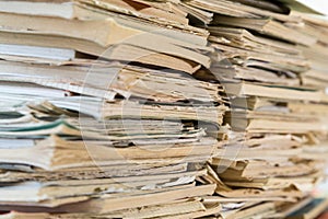 A stack of old school notebooks. Multicolored cover