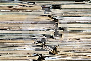 A stack of old school notebooks. Multicolored cover