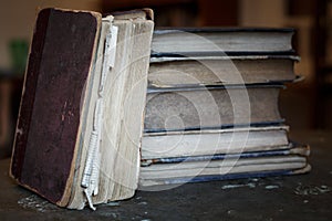 A stack of old tattered books.