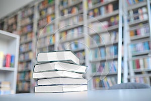 Stack of old textbooks lying on the table