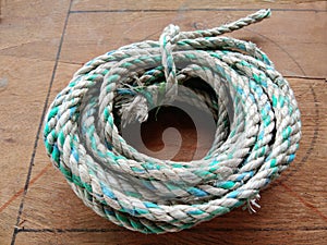 Stack of old thick rope on floor