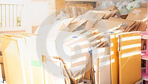 Stack of old use cardboard boxes and ready to be sent for recycling at warehouse