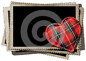 Stack of old vintage photo frames and a fabric heart shape