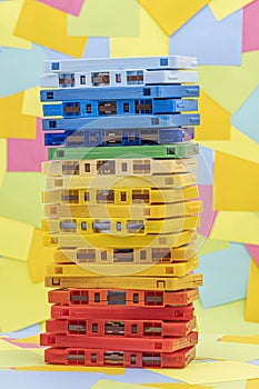 Stack of old vintage retro multicolored audio tape cassettes