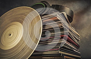 Stack of old vinyl records on the table. Retro style toned image