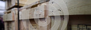 Stack of old wooden packaging boxes standing in column