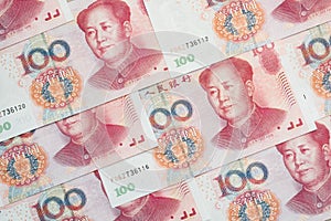 Stack of one hundred Chinese yuan bills as money background.