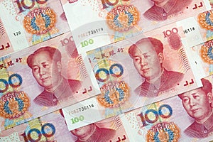 Stack of one hundred Chinese yuan bills as money background.