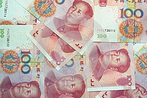 Stack of one hundred Chinese yuan bills as money background.