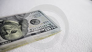 Stack of one hundred dollar bills close-up