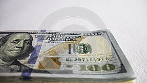 Stack of one hundred dollar bills close-up