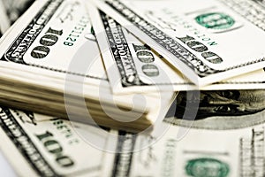 Stack of one hundred dollar bills close-up.