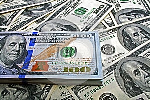 Stack of one hundred dollar bills