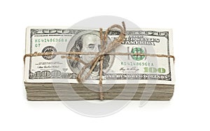 Stack of One Hundred Dollar Bills Tied in a Burlap String on White