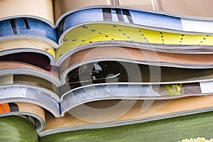 Stack of open magazines