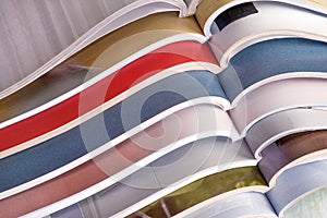 Stack of open magazines