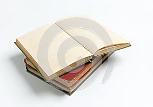 Stack of open old book on white background for mockup
