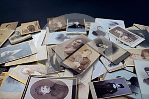 Stack of original photos circa 1870-1920 with copy space for your logo or text. Genealogy research photo