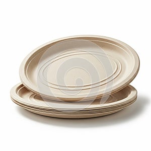 Stack of Oval Beige Biodegradable Disposable Plates on White Background compostable eco-friendly