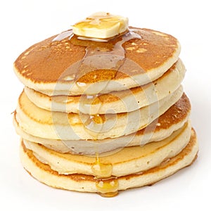 Stack of pancakes with butter isolated on white background