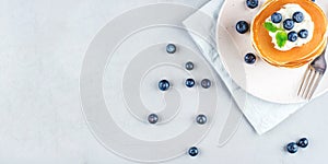 Stack of pancakes with fresh blueberry.