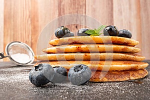 Stack of pancakes with fresh blueberry and caramel syrup