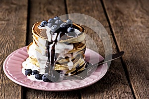 Stack of Pancakes with Fresh Blueberry and Cream Tasty Breakfast Wooden Table Horizontal Copy Space Dark Photo