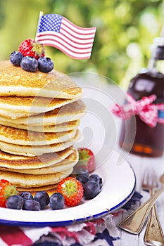 Stack of pancakes with fresh fruit