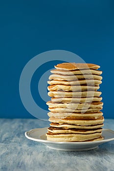 Stack of pancakes with hone