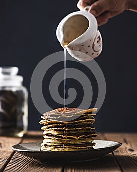 Stack of pancakes with honey syrup