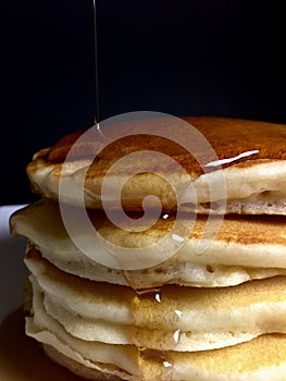 Stack of pancakes with maple syrup