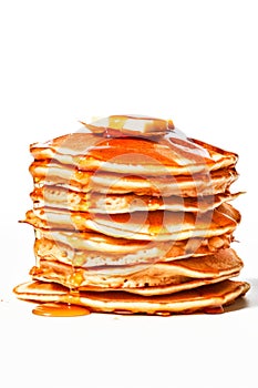 A stack of pancakes with syrup and butter on top, AI